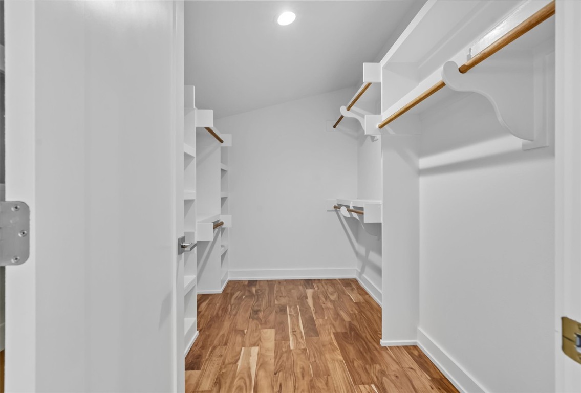 2712 Oak Springs Drive, Unit A Austin, TX 78702 - Photo 23 of 34 a view of empty room with wooden floor and fan