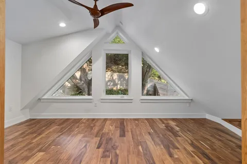 a balcony view with a seating space