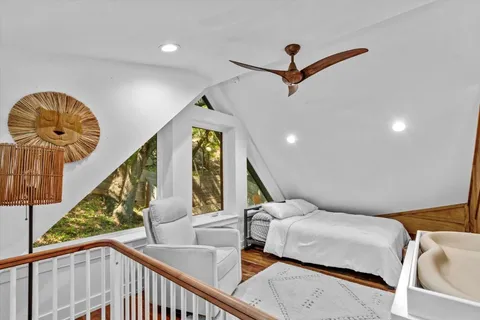 an aerial view of a house with a yard