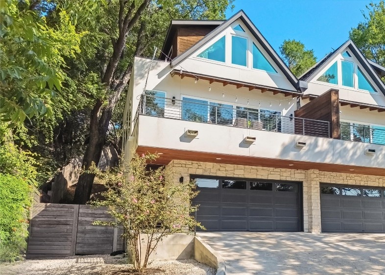 2712 Oak Springs Drive, Unit A Austin, TX 78702 - Photo 3 of 34 a front view of a building with garage