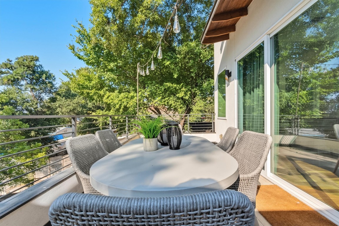 2712 Oak Springs Drive, Unit A Austin, TX 78702 - Photo 31 of 34 a view of balcony with patio and outdoor seating
