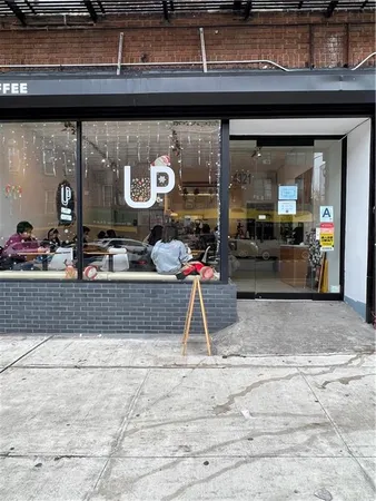 a view of street with sitting area