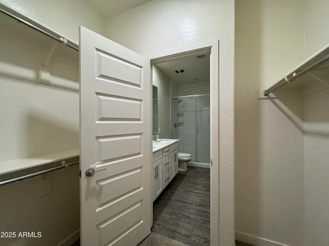 a bathroom with a shower and a sink
