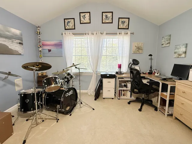 a bathroom with a double vanity sink and mirror with toilet