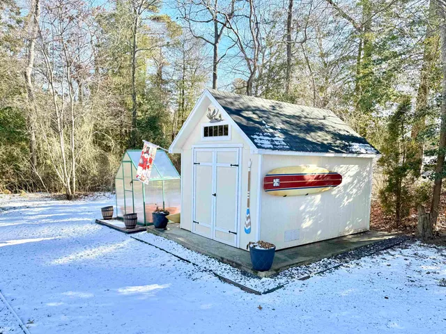 a view of a balcony with two chairs and a table