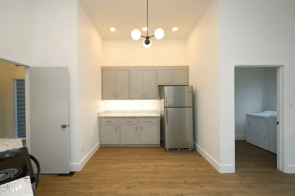 a view of a kitchen with a sink and dishwasher