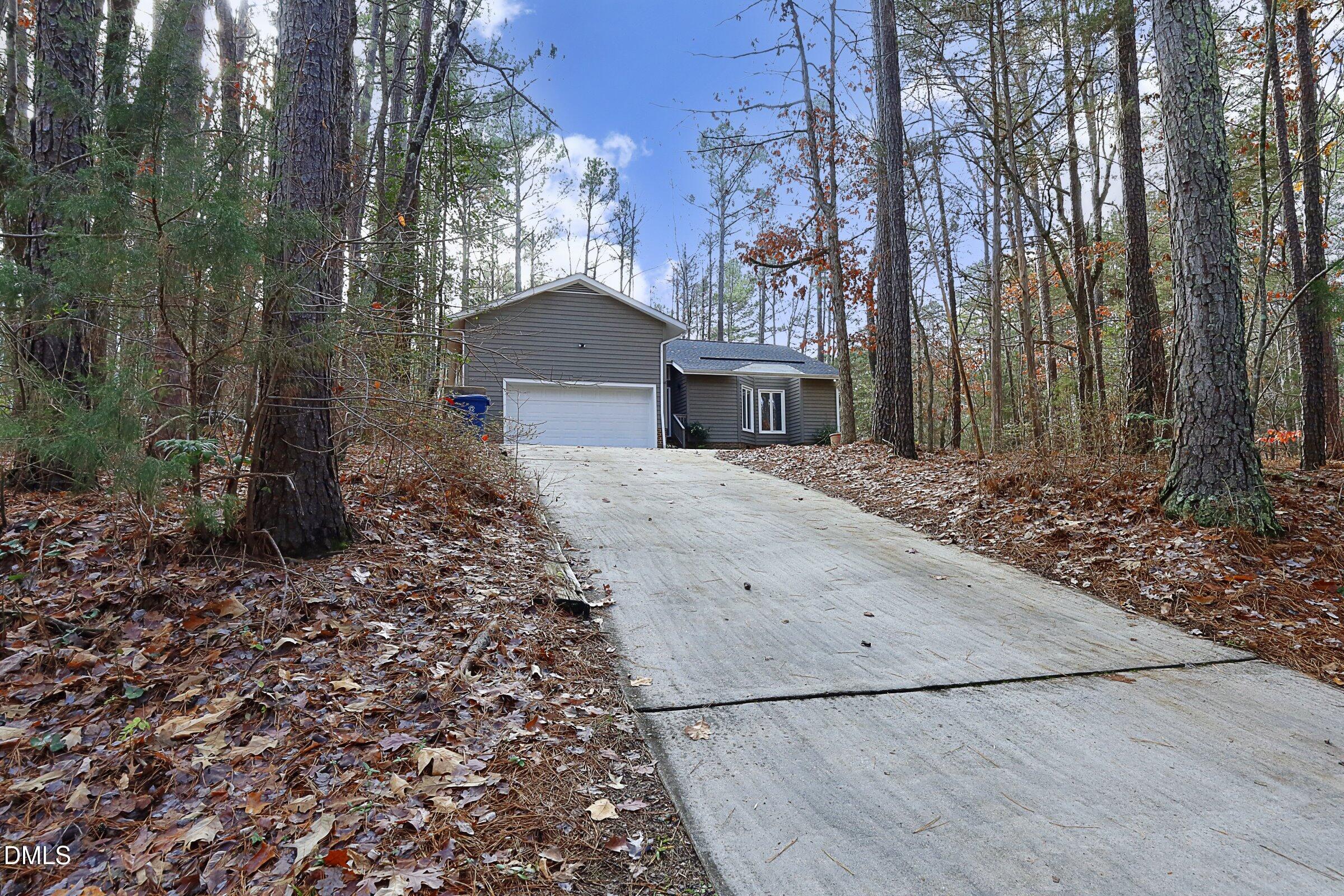 237 Glen Eden Road Durham, NC 27713 - Photo 2 of 37 a front view of a house with yard and trees
