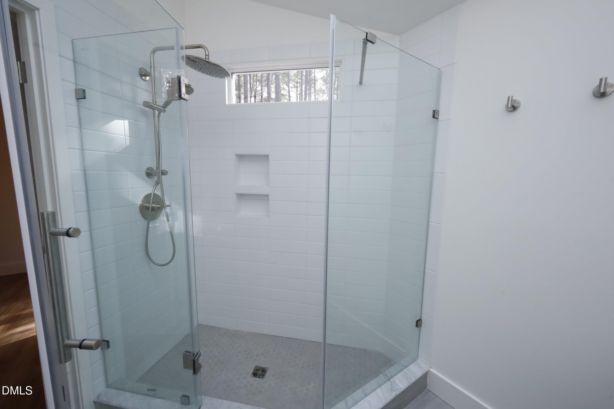 237 Glen Eden Road Durham, NC 27713 - Photo 22 of 37 a bathroom with a glass shower door