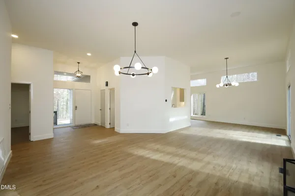a view of a kitchen with a sink and a chandelier
