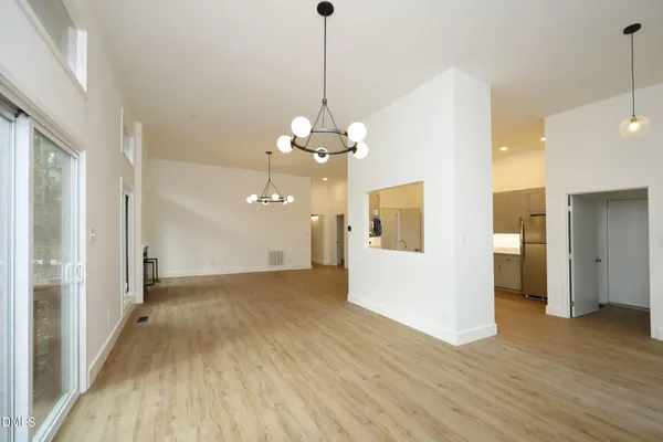 a view of a livingroom with wooden floor