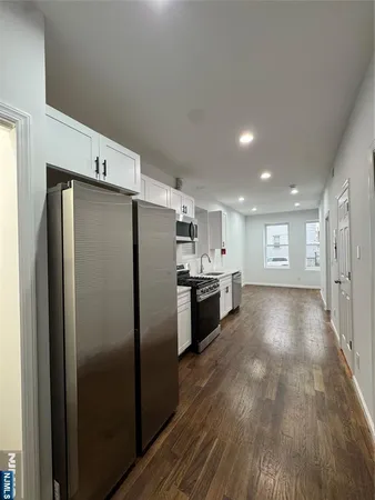 a view of a refrigerator in kitchen and a refrigerator