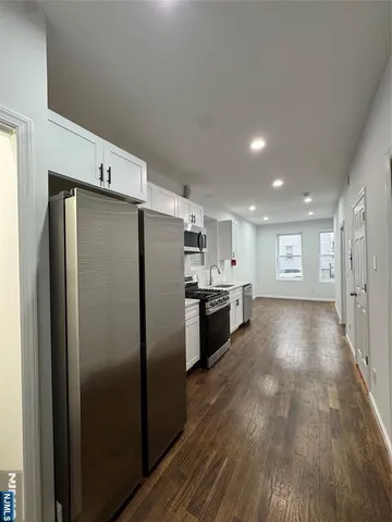 a view of a refrigerator in kitchen and a refrigerator