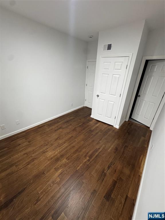 196 Malvern Street, Unit 1 Newark, NJ 07105 - Photo 11 of 16 a view of empty room with wooden floor