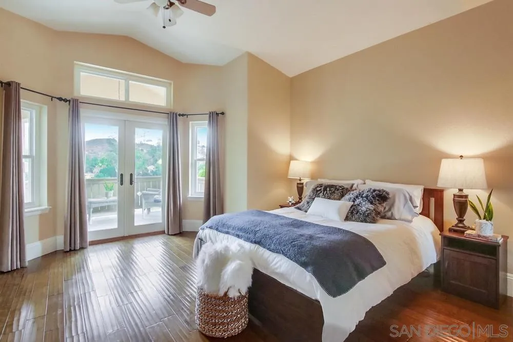 13927 Lake Poway Road Poway, CA 92064 - Photo 54 of 74 a bedroom with a bed and a large window