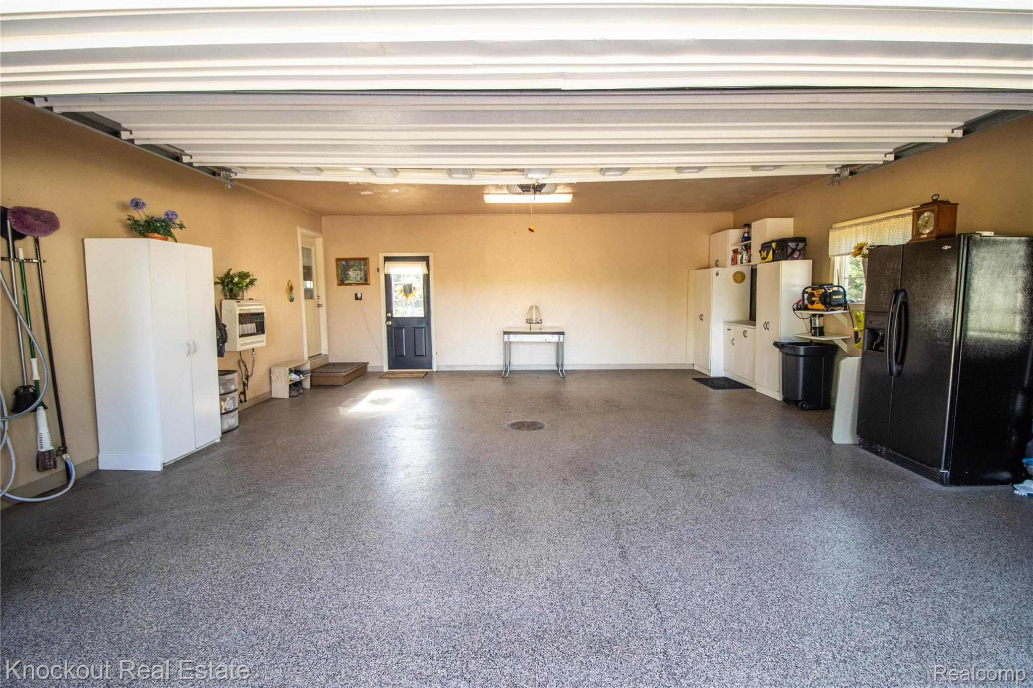 14720 Lincoln Road Chesaning, MI 48616 - Photo 53 of 60 Epoxy-coated concrete flooring with a speckled finish