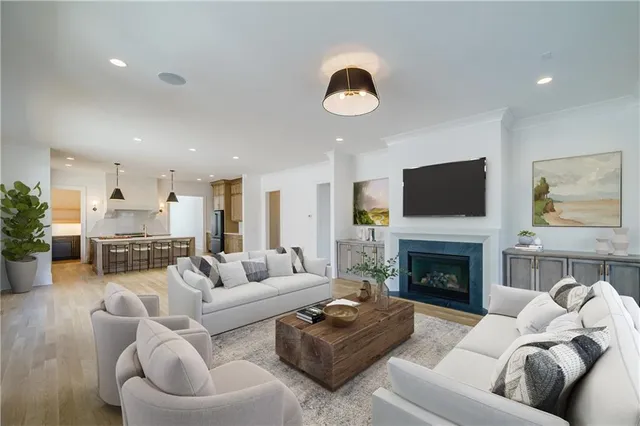 a living room with furniture fireplace and a fireplace