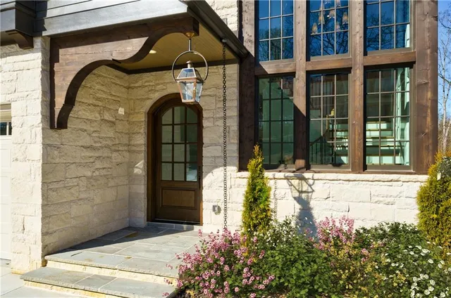 a front view of a house with a glass door