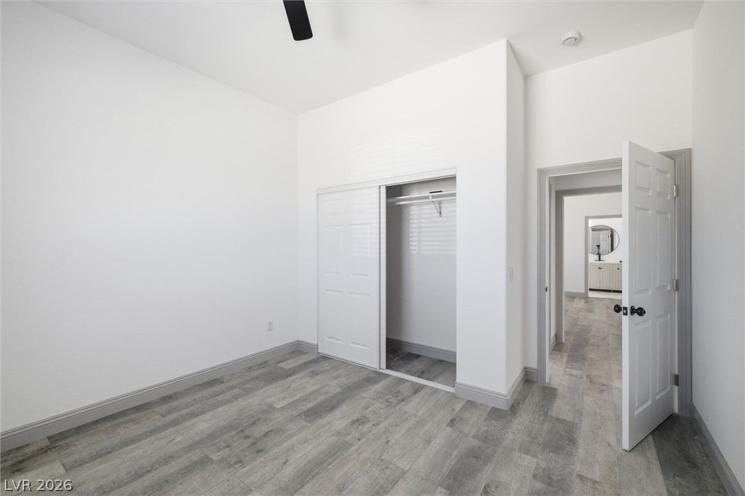 1061 Factory Road Pahrump, NV 89048 - Photo 19 of 41 A comfortable bedroom with neutral tones and durable flooring offers a serene personal retreat.