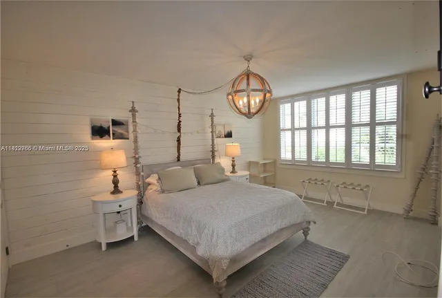 a bathroom with a sink mirror and shower