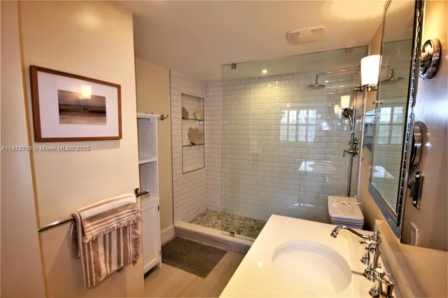 a bathroom with a sink a mirror and a bathtub