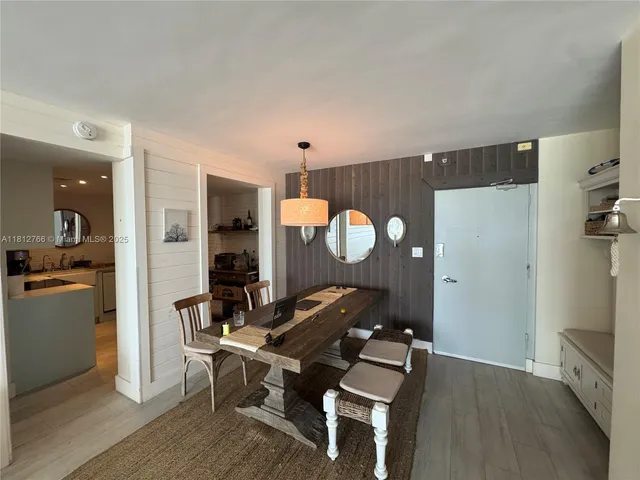 a living room with furniture a window and a table