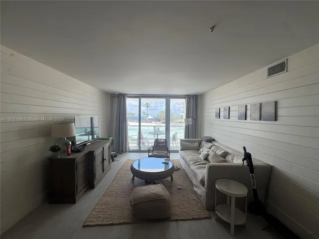a kitchen with a sink and steel appliances