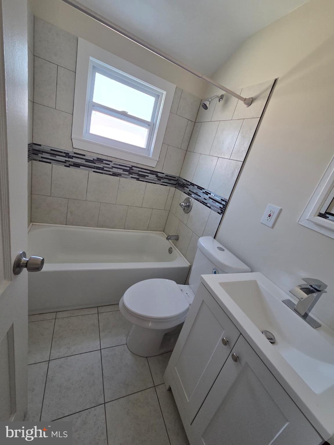 1930 Frames Road Dundalk, MD 21222 - Photo 29 of 30 a bathroom with a granite countertop sink and a mirror