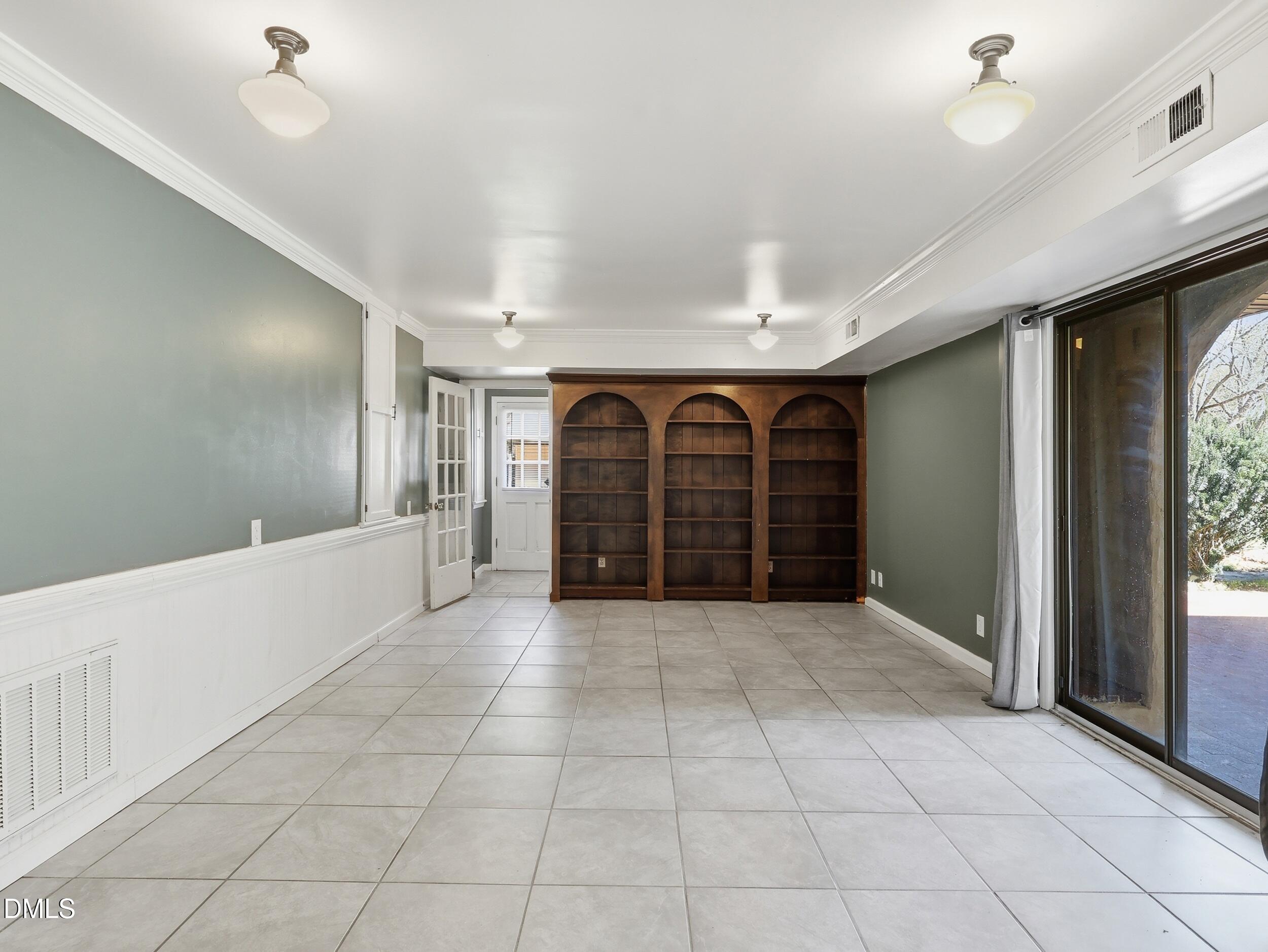 19405 Highway 210 Angier, NC 27501 - Photo 12 of 49 a view of a hallway with a chandelier