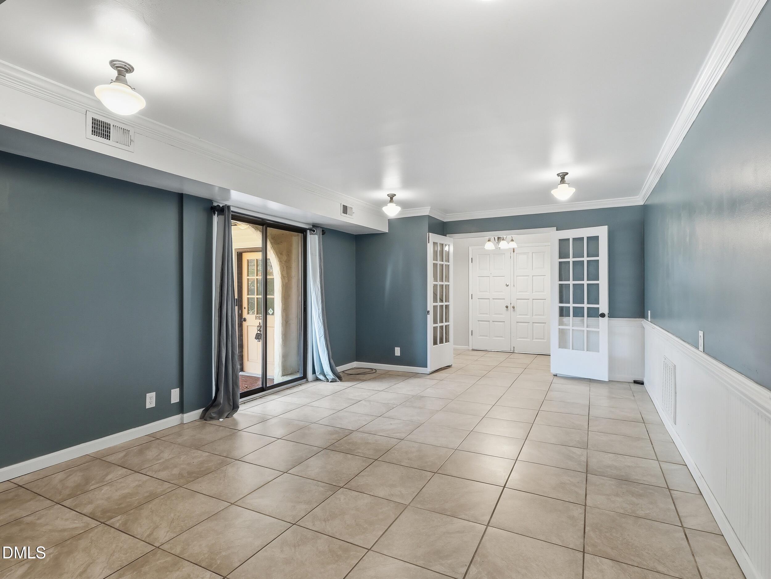19405 Highway 210 Angier, NC 27501 - Photo 13 of 49 a view of an empty room with window and cabinet