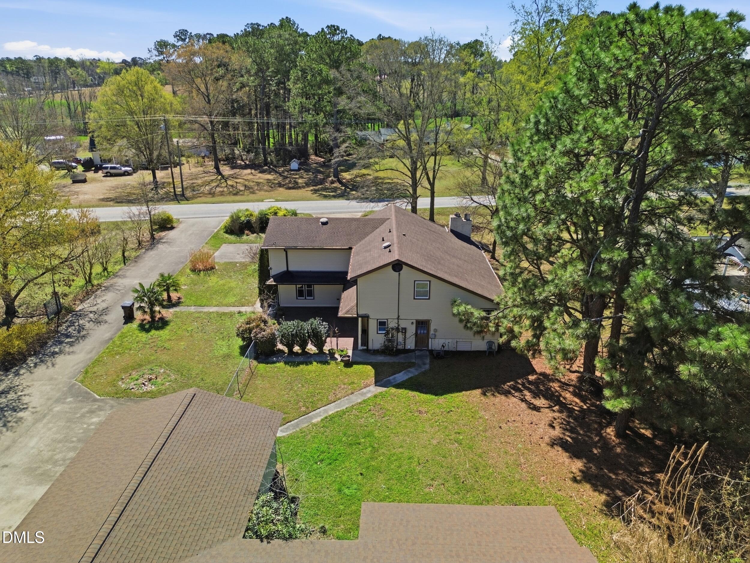 19405 Highway 210 Angier, NC 27501 - Photo 16 of 49 a view of a house with a yard