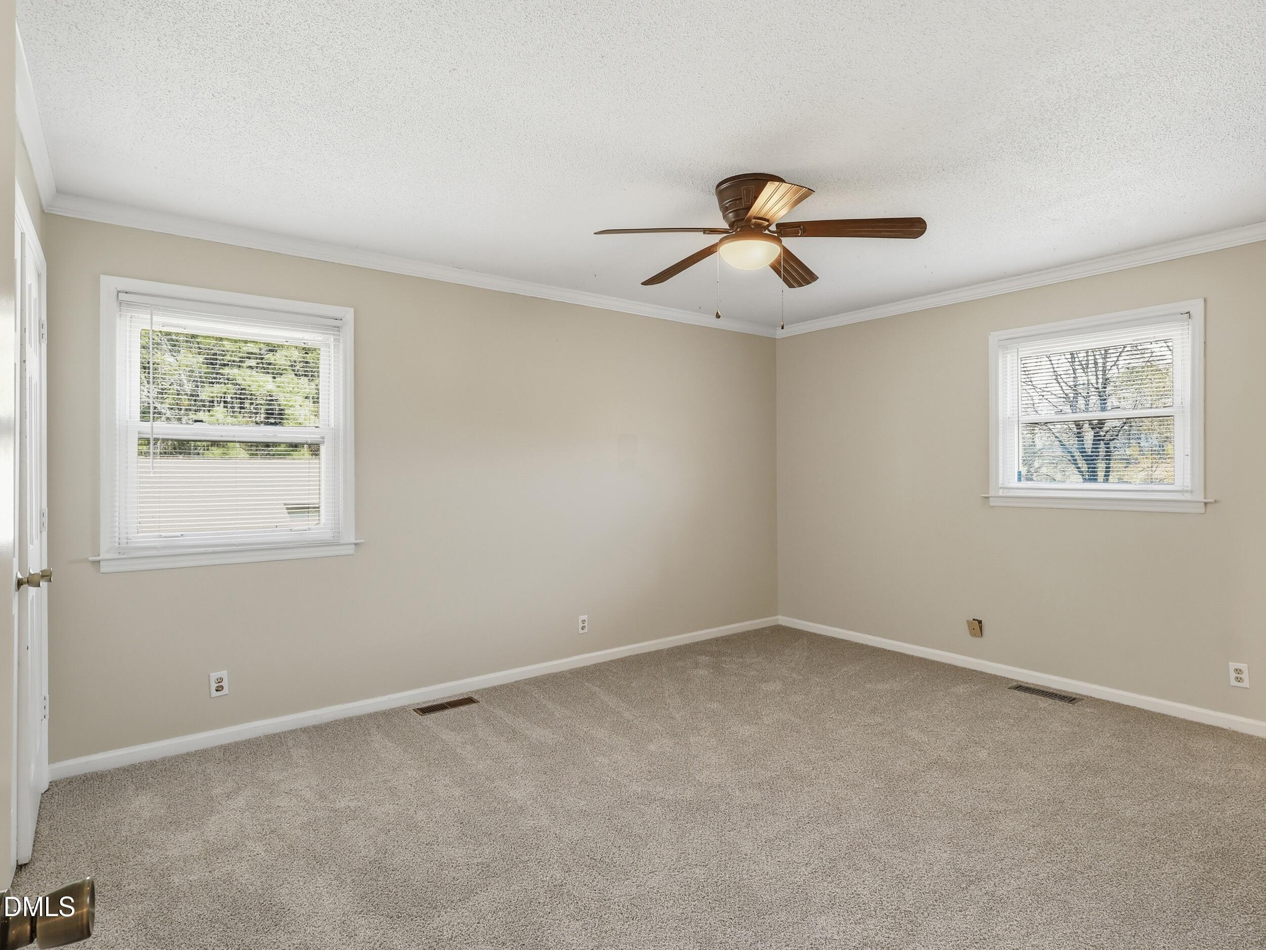 19405 Highway 210 Angier, NC 27501 - Photo 22 of 49 a view of room with ceiling fan and window