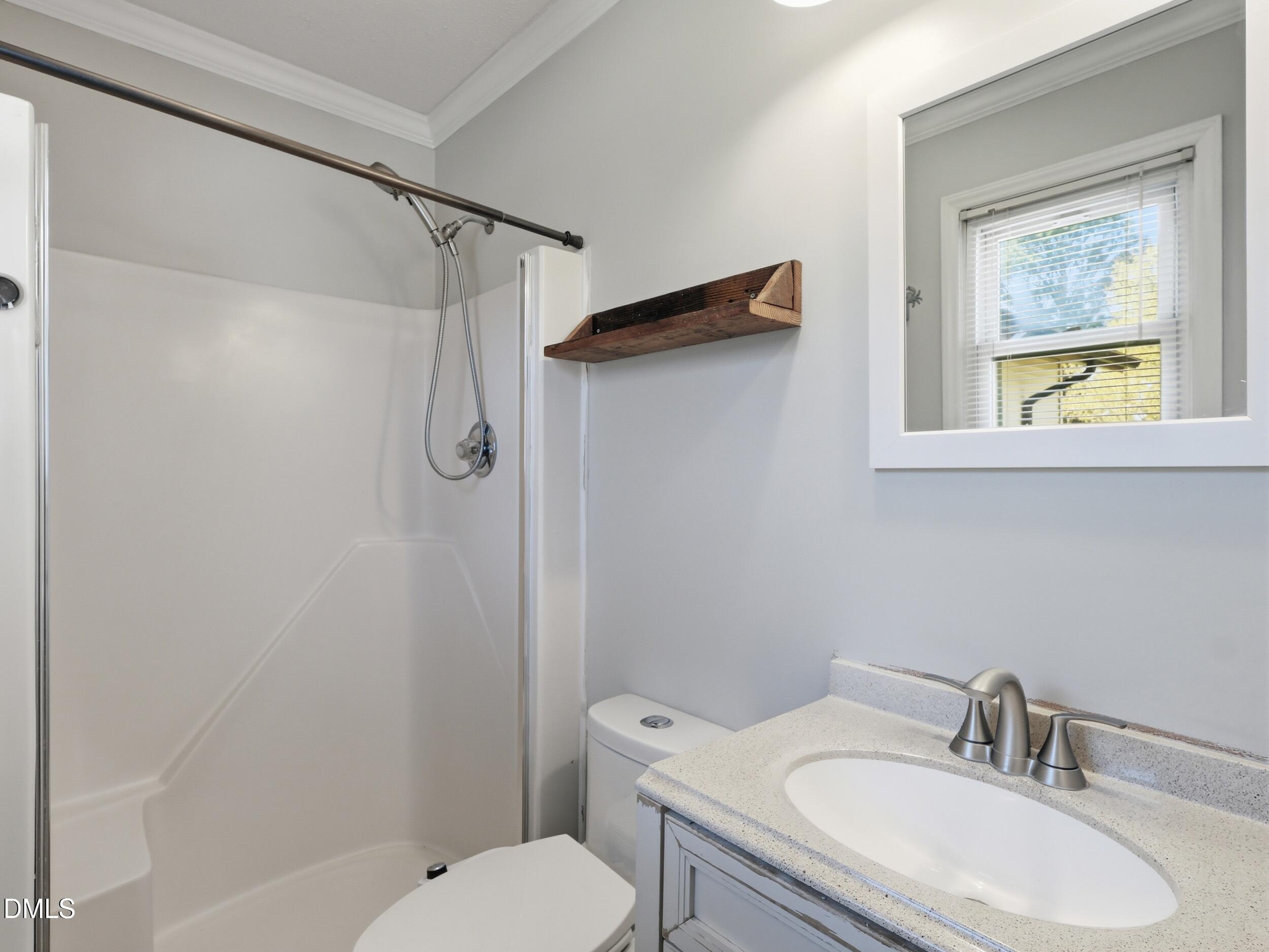 19405 Highway 210 Angier, NC 27501 - Photo 23 of 49 a bathroom with a sink toilet and shower