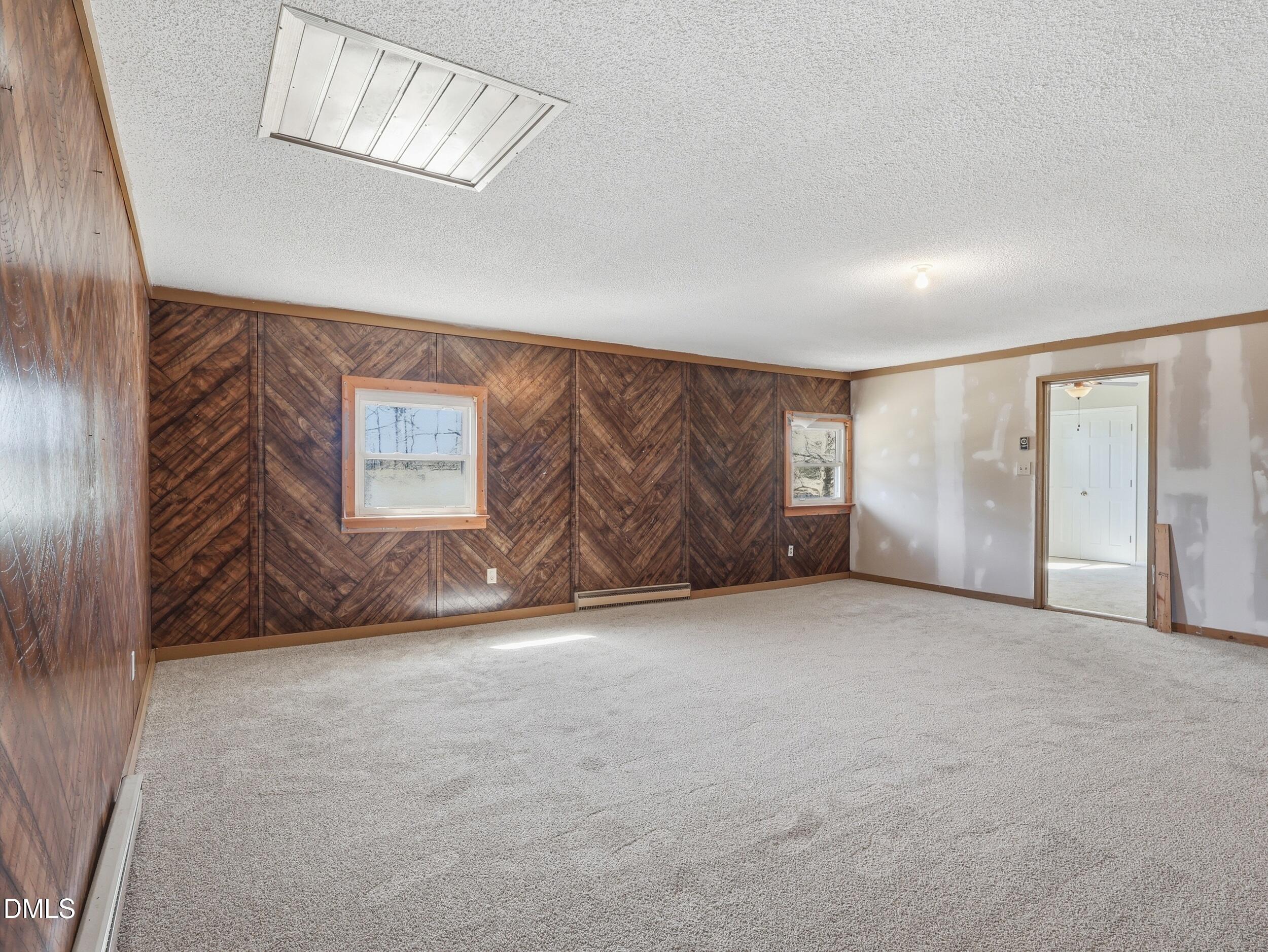 19405 Highway 210 Angier, NC 27501 - Photo 28 of 49 an empty room with windows