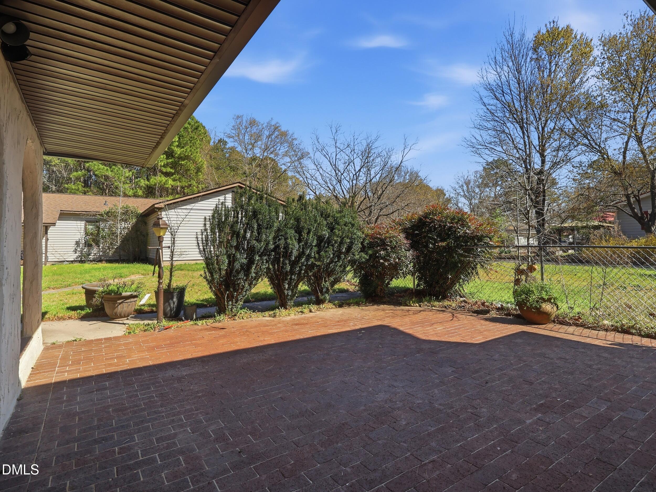 19405 Highway 210 Angier, NC 27501 - Photo 33 of 49 a backyard of a house with a yard and outdoor seating