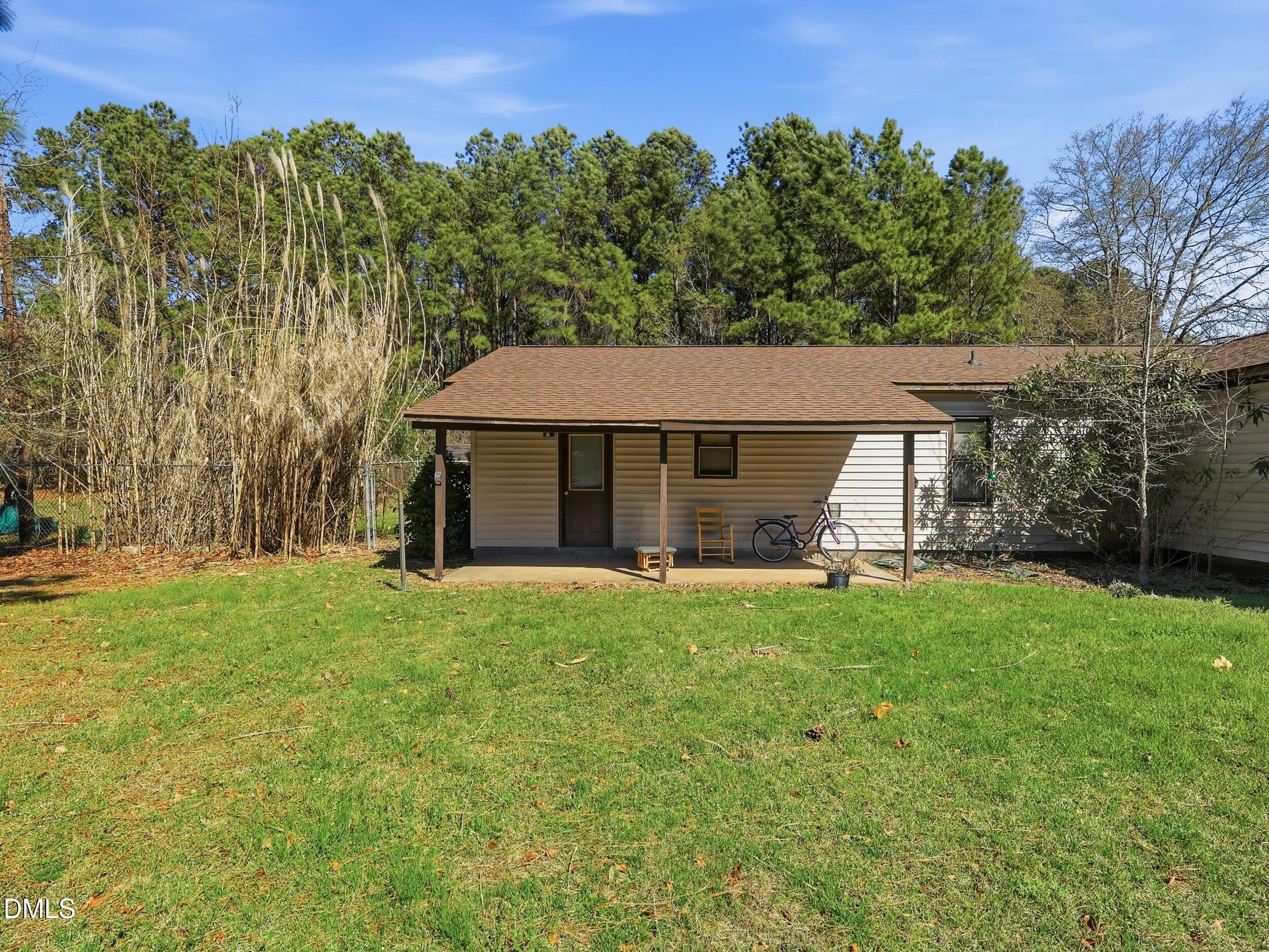 19405 Highway 210 Angier, NC 27501 - Photo 38 of 49 a view of a house with a backyard