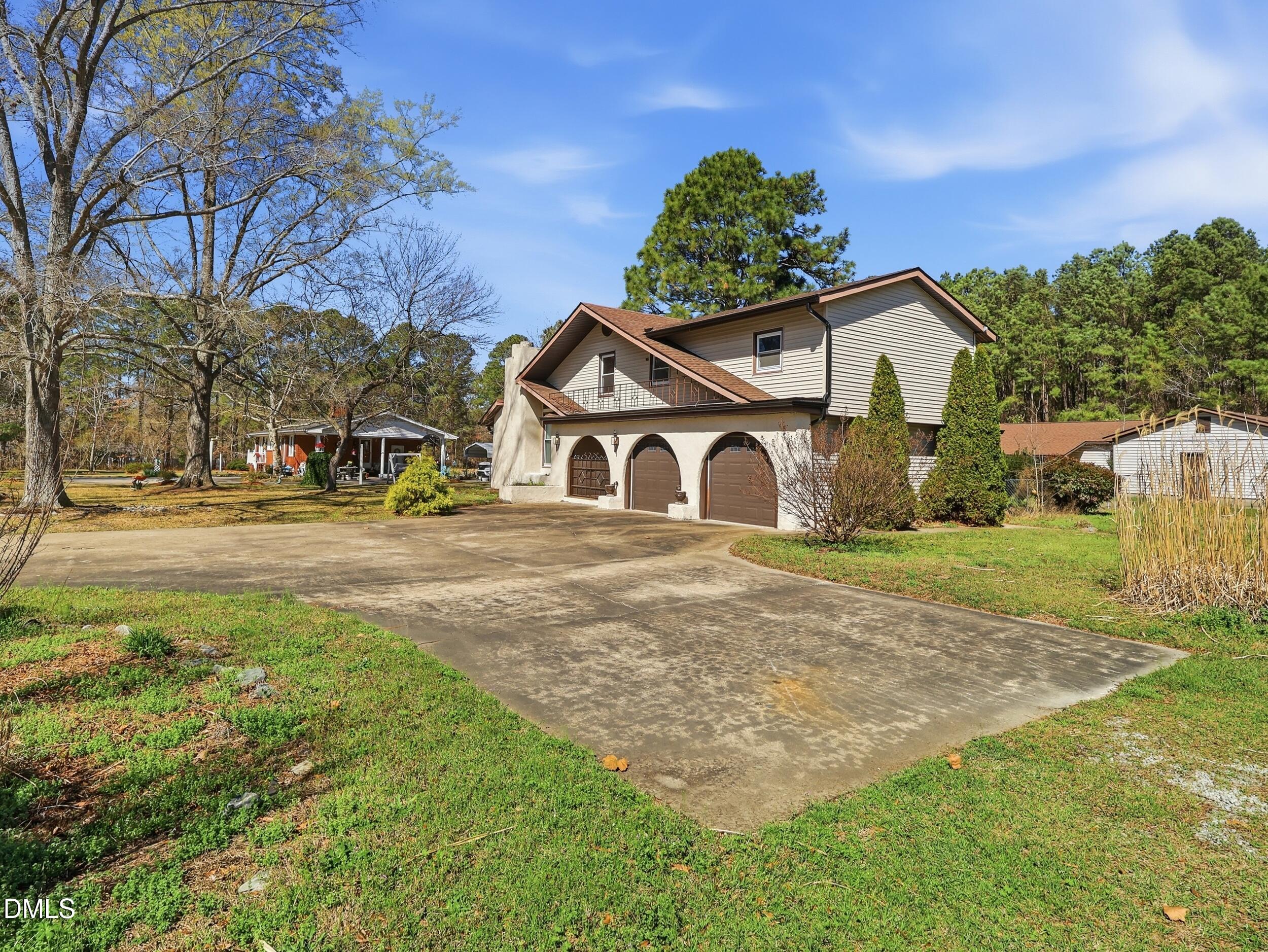19405 Highway 210 Angier, NC 27501 - Photo 40 of 49 a view of a house with a yard