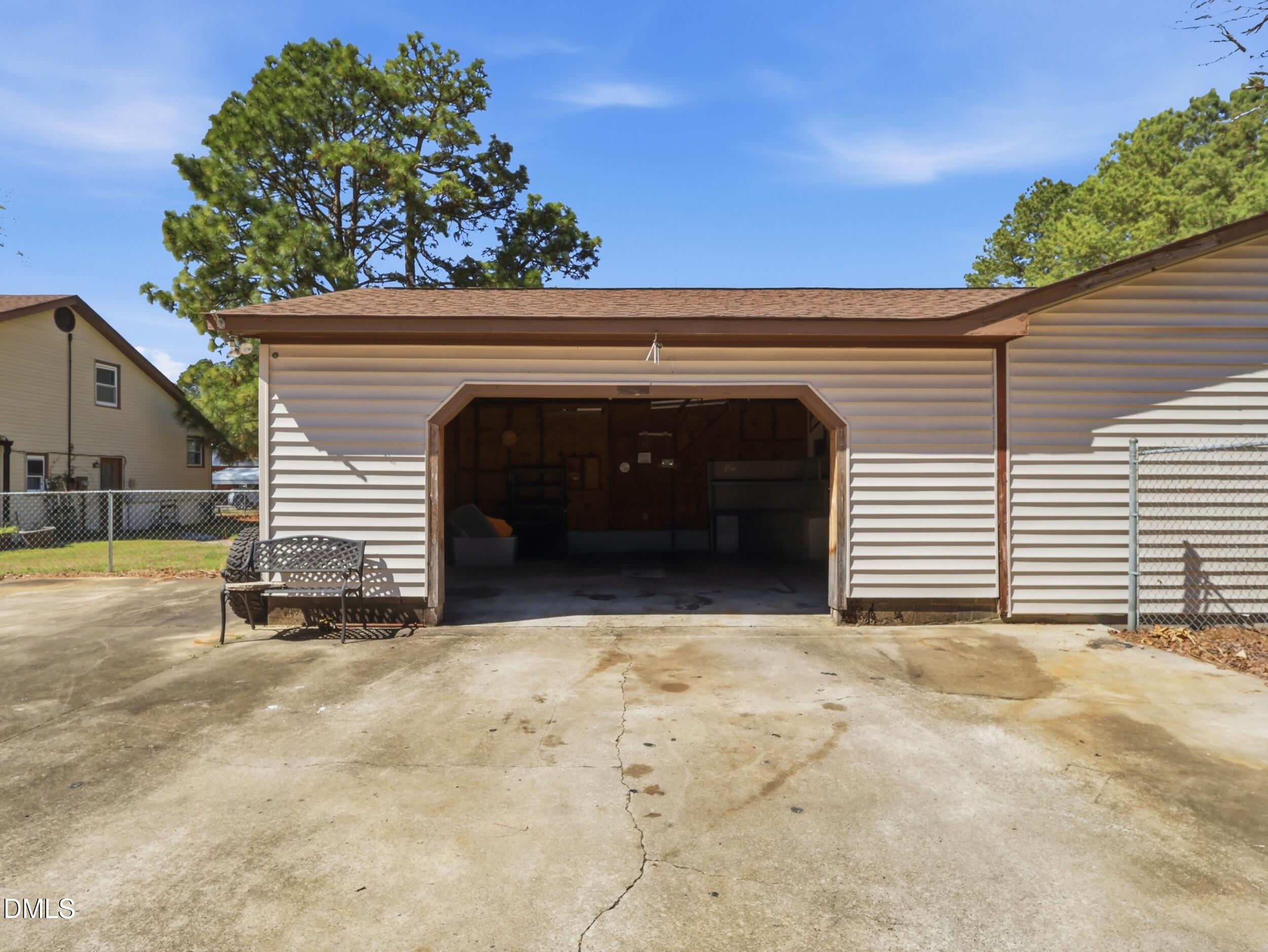 19405 Highway 210 Angier, NC 27501 - Photo 49 of 49 a view of a house with a garage