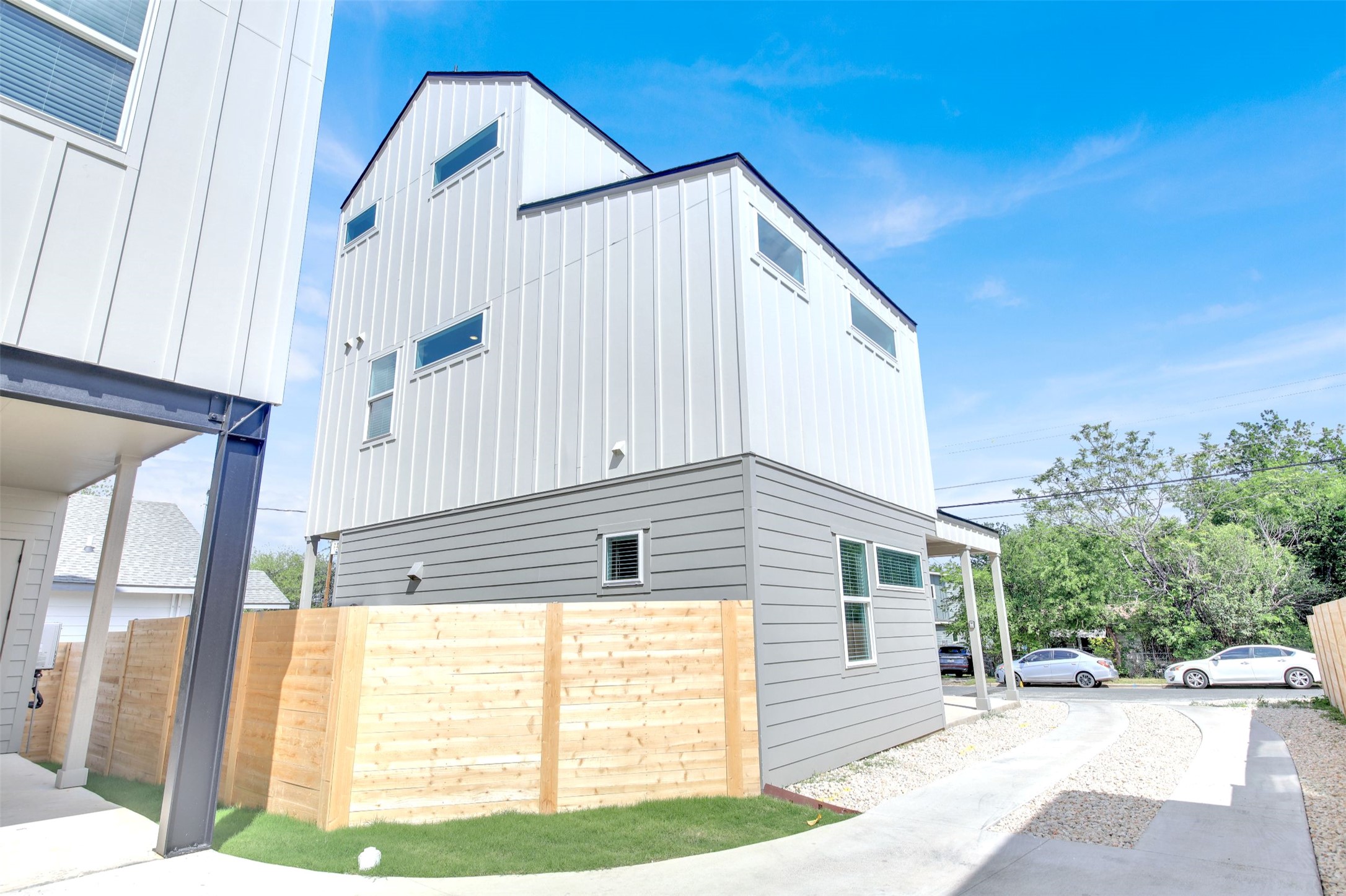 7208 Providence Avenue, Unit 1 Austin, TX 78752 - Photo 26 of 26 The property features modern architectural styling with vertical panel siding on the upper floors and horizontal siding on the lower level
