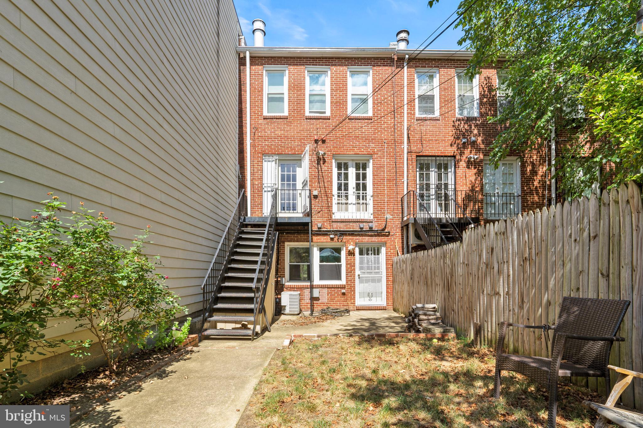 1815 East Capitol Street Southeast, Unit 1 Washington, DC 20003 - Photo 18 of 19 a front view of a house with a yard