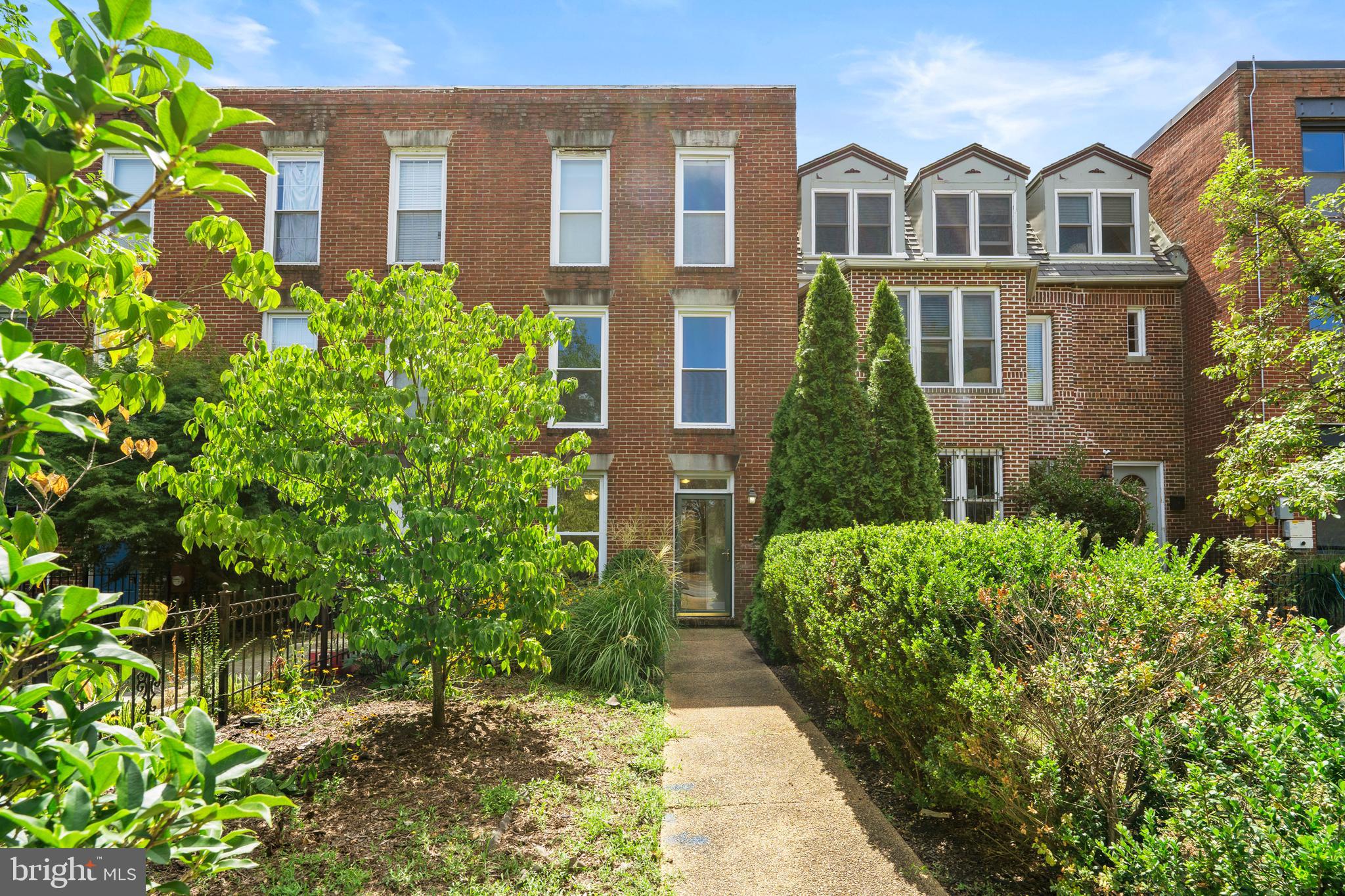 1815 East Capitol Street Southeast, Unit 1 Washington, DC 20003 - Photo 2 of 19 a front view of a house with a yard