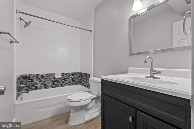 a kitchen with stainless steel appliances granite countertop a stove and a microwave