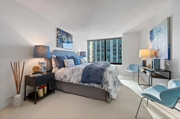a bed room with a bed and a lamp
