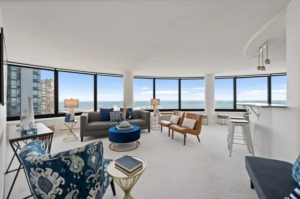 a living room with furniture and a large window