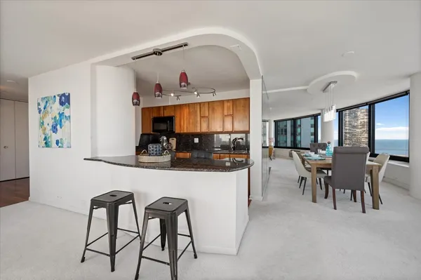 a kitchen with a table and chairs in it