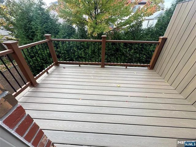 a view of balcony with wooden floor