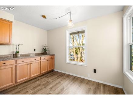 8496 Southwest Mohawk Street Tualatin, OR 97062 - Photo 12 of 39 a open hall with wooden floor and view living room