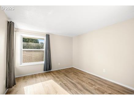8496 Southwest Mohawk Street Tualatin, OR 97062 - Photo 20 of 39 a view of an empty room with a window