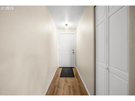 8496 Southwest Mohawk Street Tualatin, OR 97062 - Photo 7 of 39 a view of a hallway with wooden floor