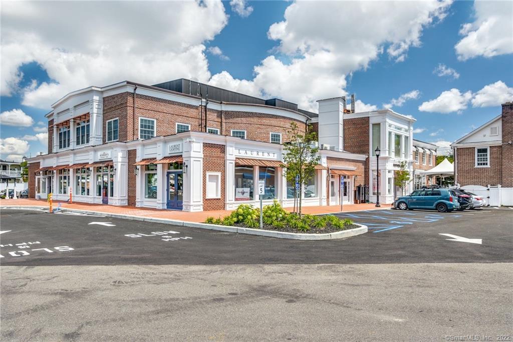 a front view of a building with a street