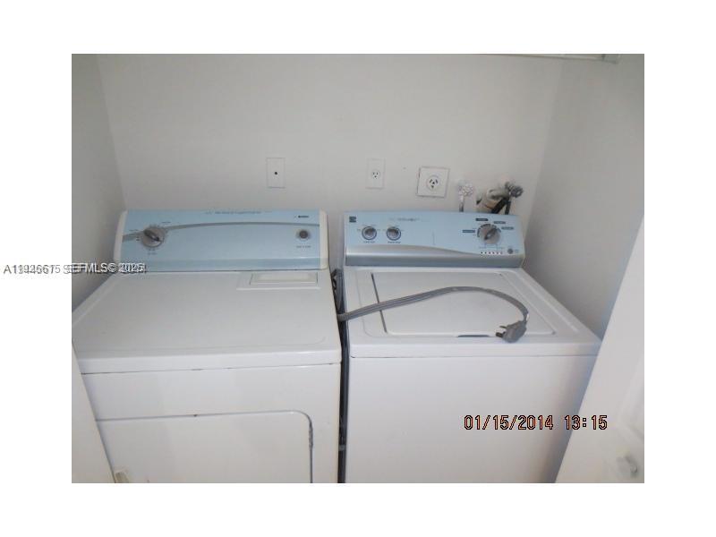 13981 Southwest 160th Terrace, Unit 13981 Miami, FL 33177 - Photo 7 of 7 a utility room with dryer and washer